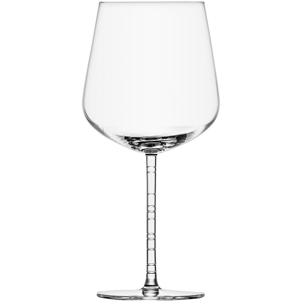 A close-up of a clear Schott Zwiesel Journey Burgundy wine glass with a stem.
