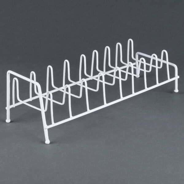 A white metal rack with 8 pegs.