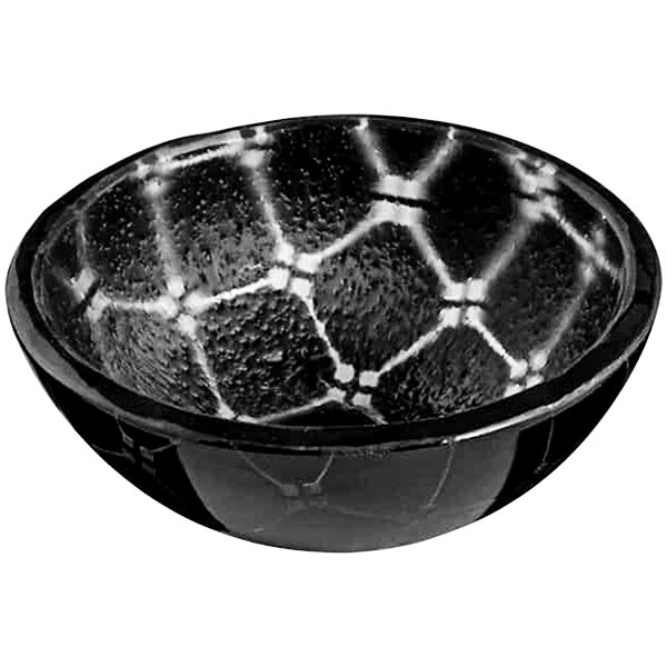 A black glass bowl with a white geometric design.