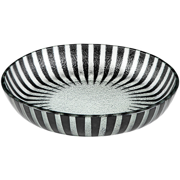 A black glass bowl with a black rim and black and white stripes.