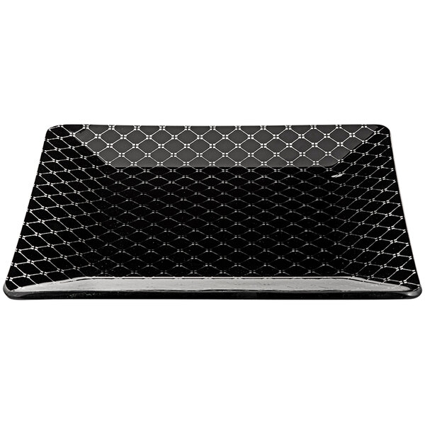 A black square glass platter with a pattern on it.