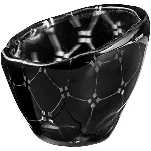 A black glass bowl with a pattern on it.
