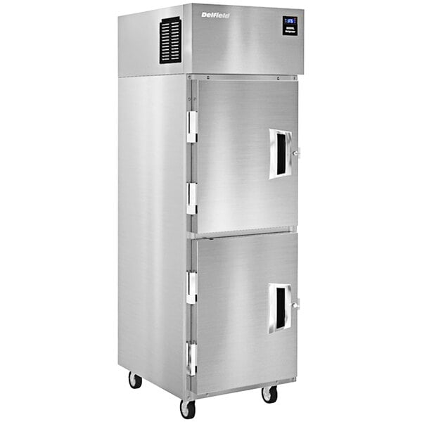 A stainless steel Delfield reach-in freezer with half doors.