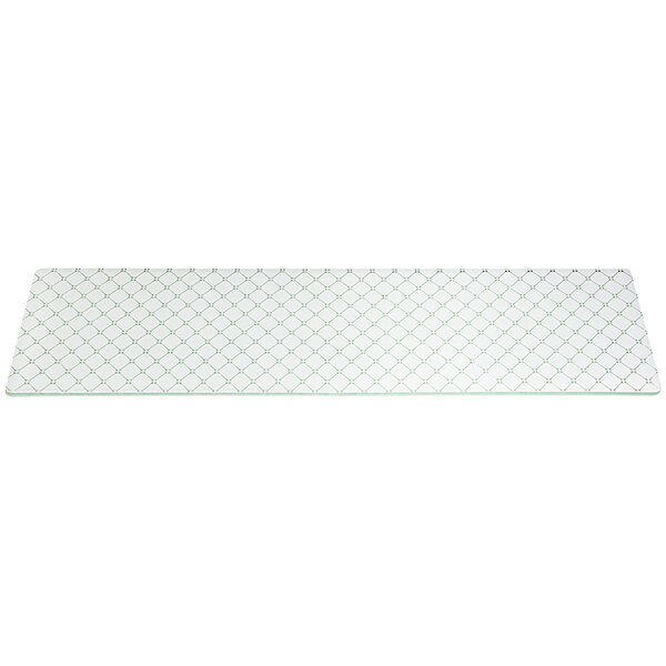 A close-up of a white glass rectangular riser with a grid pattern.