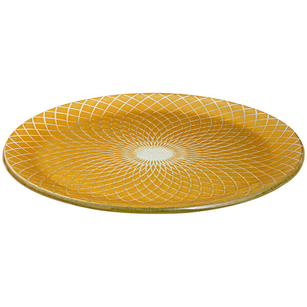 A yellow glass platter with white circular designs.