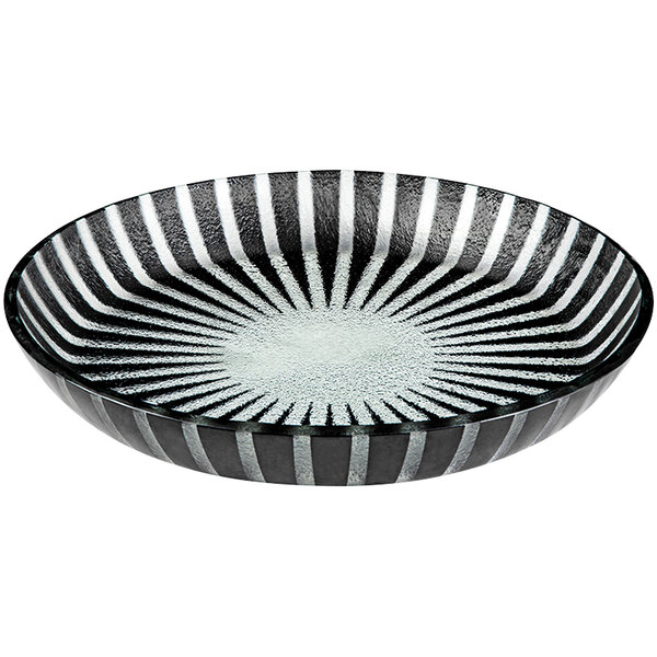 A black glass bowl with a striped design on a white background.
