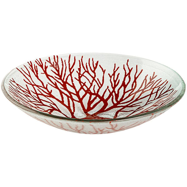 A red glass bowl with red and white branch designs.