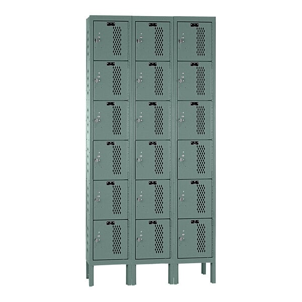 A gray Hallowell triple 6-tier box locker with 6 compartments.