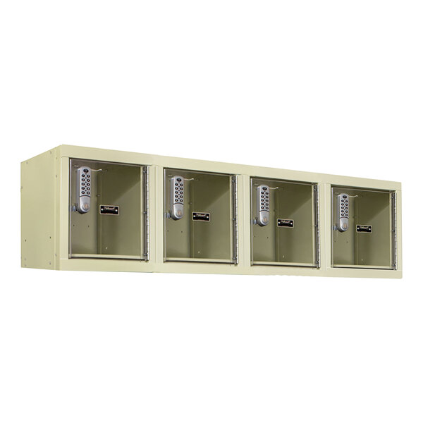 A row of four tan Hallowell DigiTech wall mount box lockers with open doors.