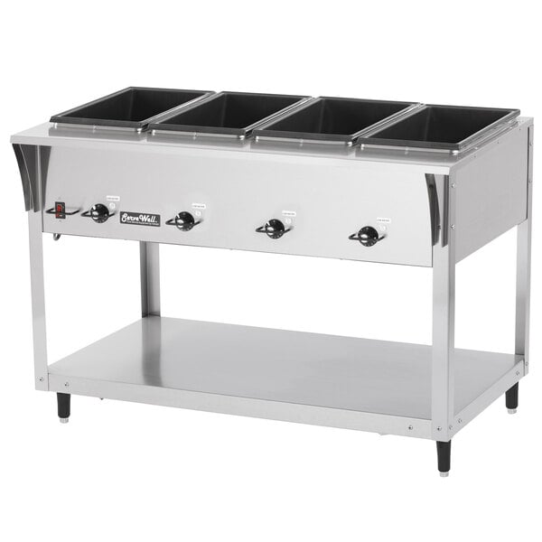 A Vollrath stainless steel electric hot food table with four pans on it.