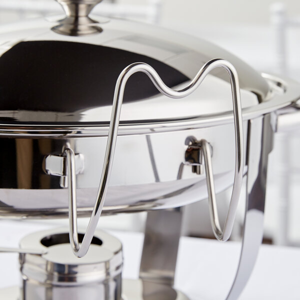 A Vollrath Orion chafer cover holder on a metal chafer.