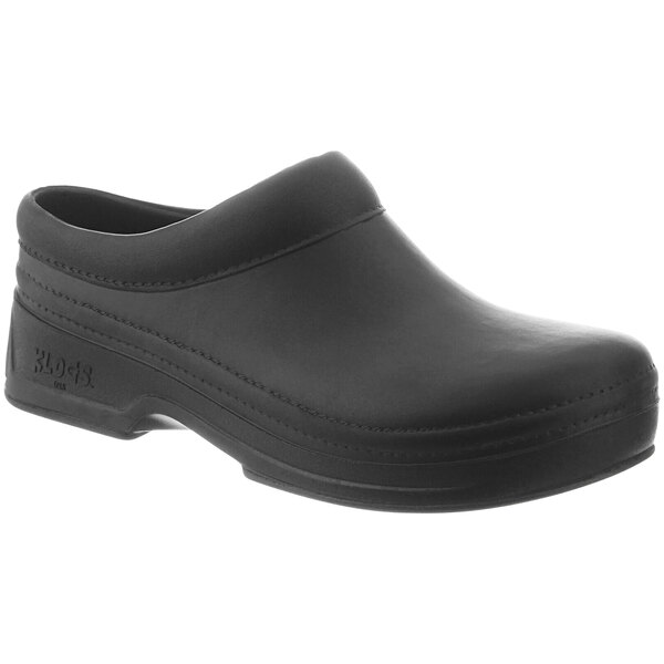 A pair of black Klogs Zest men's clogs with a white background.