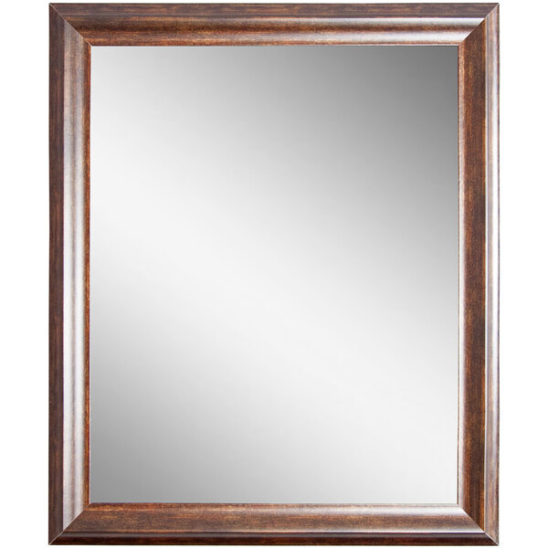 A BrandtWorks mirror with a copper brown wood frame.