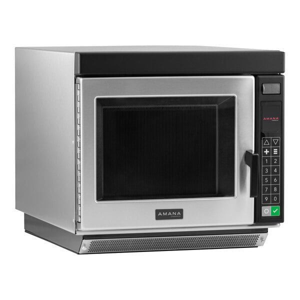A silver Amana commercial microwave oven with a black door.