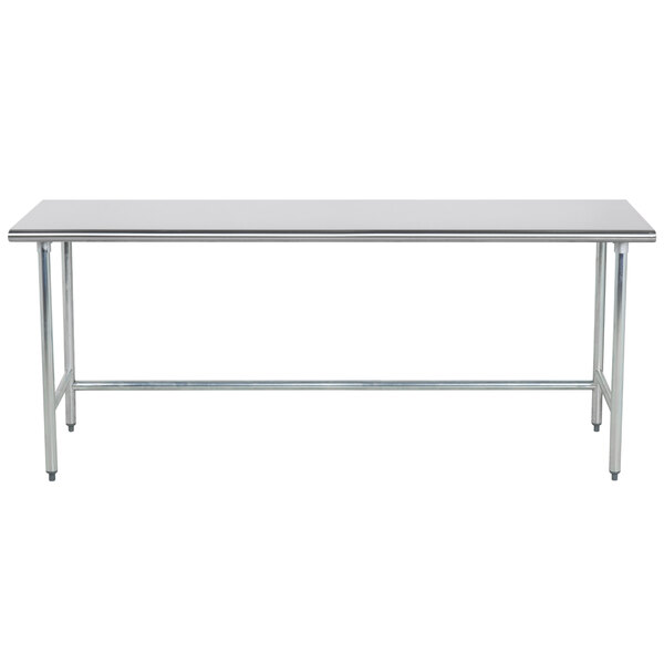An Advance Tabco stainless steel work table with an open metal base.
