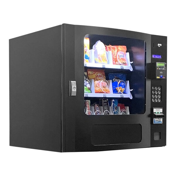 A black Seaga countertop snack vending machine with snacks behind a glass door.