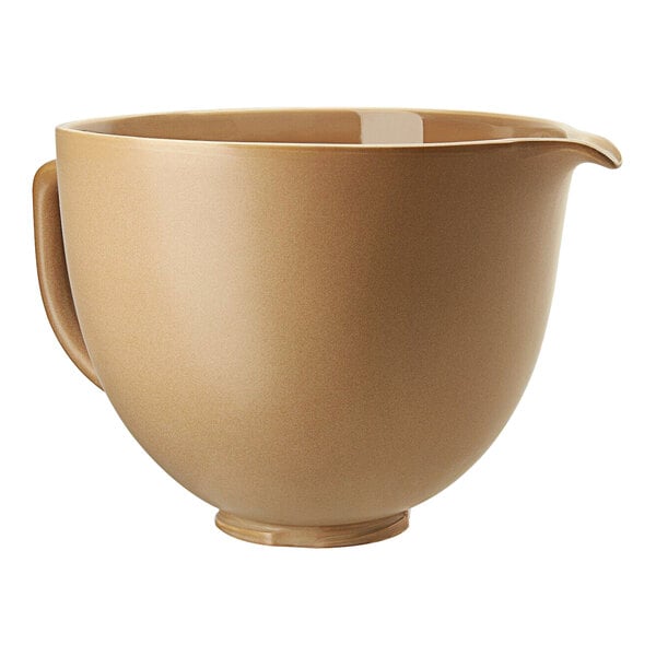 A cream colored KitchenAid ceramic mixing bowl with a handle.
