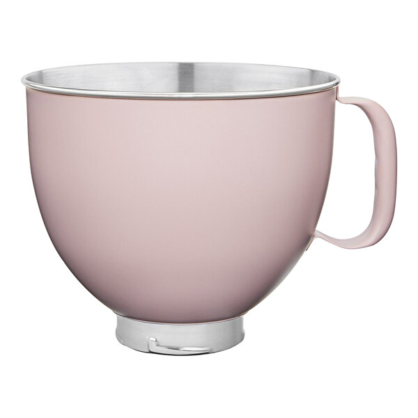 A pink stainless steel mixing bowl with a silver handle.