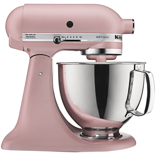 A KitchenAid Artisan stand mixer in Matte Dried Rose with a bowl.