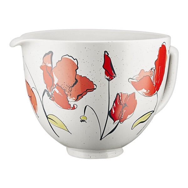 A white ceramic bowl with red flowers on it.