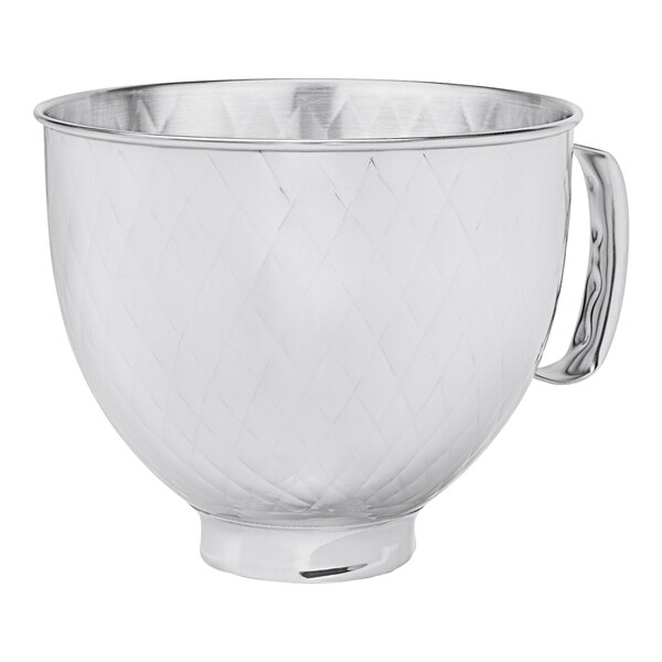 A silver KitchenAid stainless steel mixing bowl with a handle.