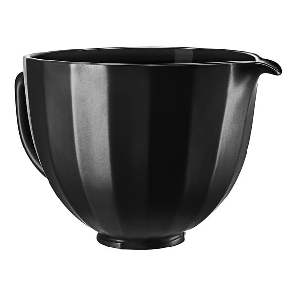 A black ceramic bowl with a handle.