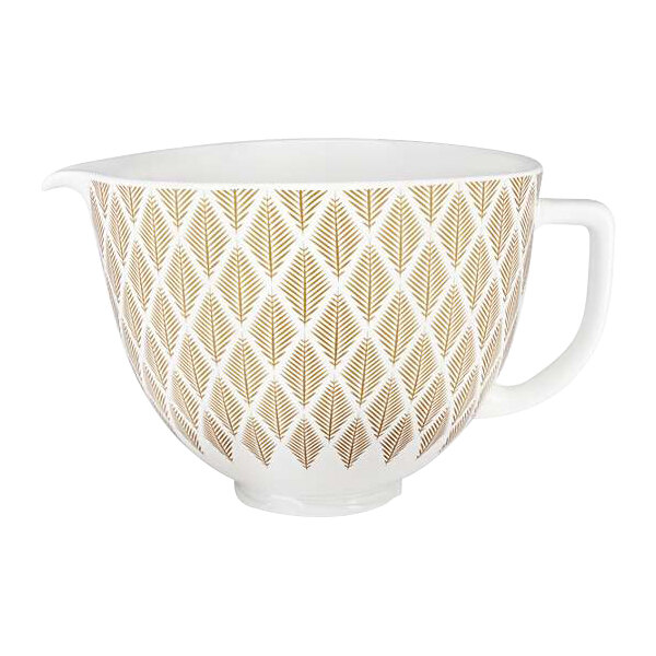 A white ceramic mixing bowl with a gold conifer pattern.