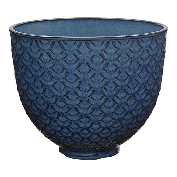 A blue bowl with black textured lace trim.