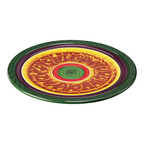 A close-up of a colorful Elite Global Solutions round melamine plate with a spiral design in green and red.