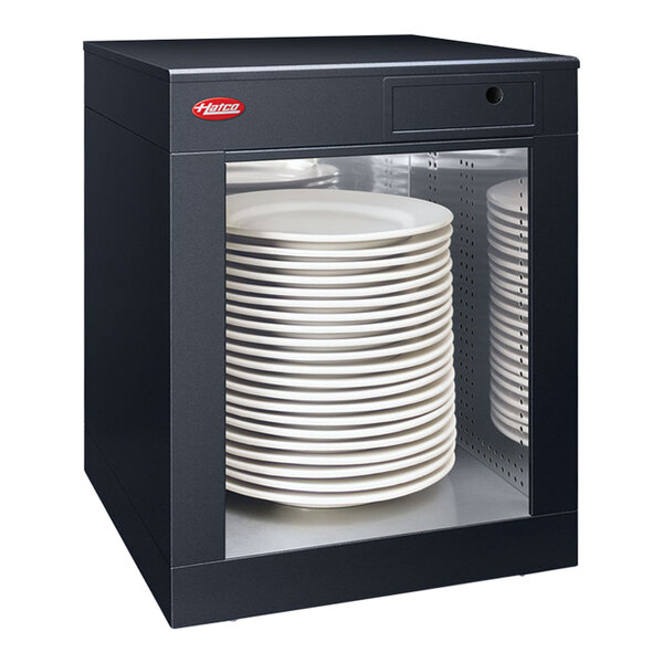 A black Hatco countertop cabinet with a stack of plates inside.