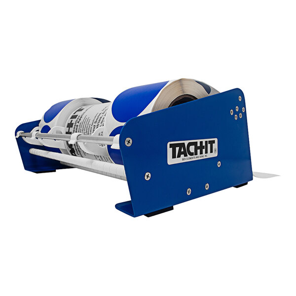 A Tach-It label roll in a blue and white container.