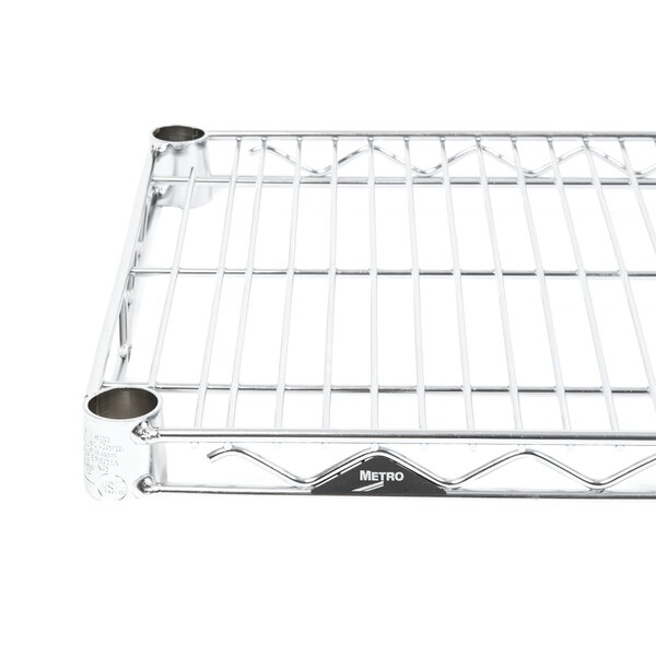 A close-up of a Metro Super Erecta chrome wire shelf with two holes.