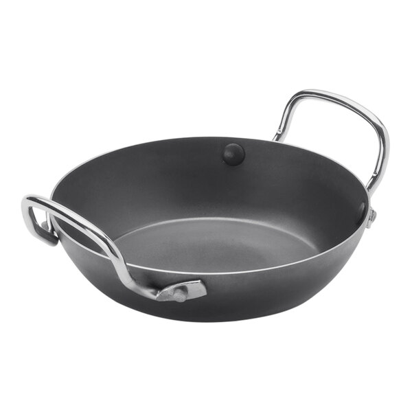 A black pan with silver handles.