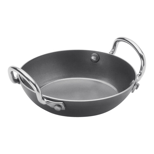 An American Metalcraft black carbon steel paella pan with handles.