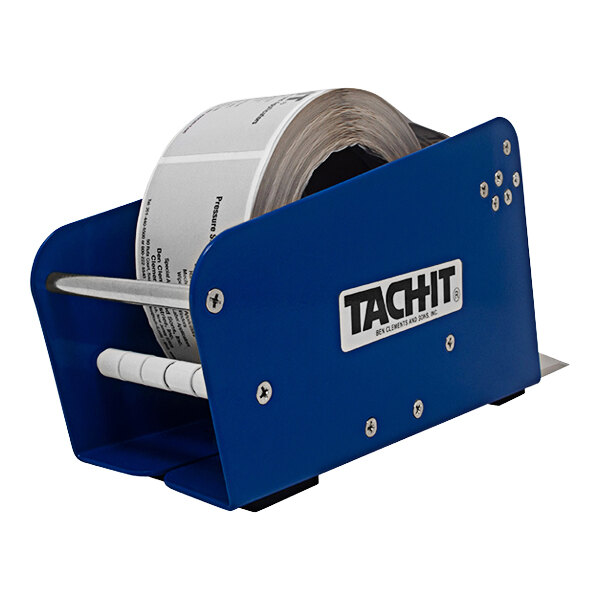 A Tach-It PDL2 tabletop label dispenser with a roll of labels in it.