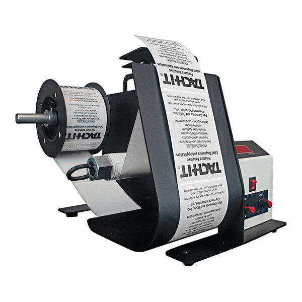 A black Tach-It KL-250 label dispenser with a roll of white paper on it.