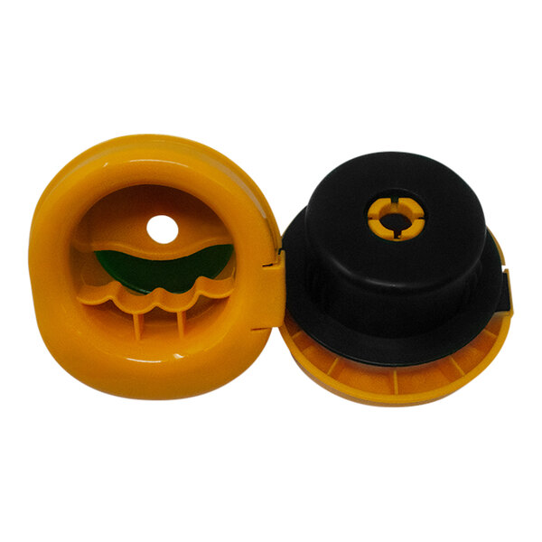 A black and yellow plastic Tach-It Stretch Wrap handle with a hole in the center.