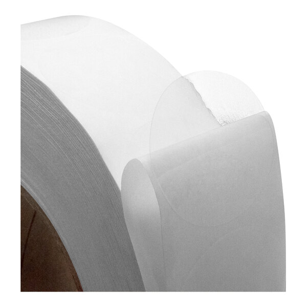 A close-up of a roll of white paper with a Tach-It label.