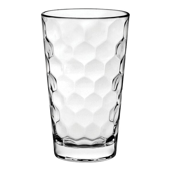 A close-up of a clear Vidivi highball glass with hexagons.