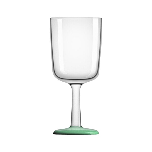 A Palm Marc Newson green Tritan plastic wine glass with a clear base and white rim.