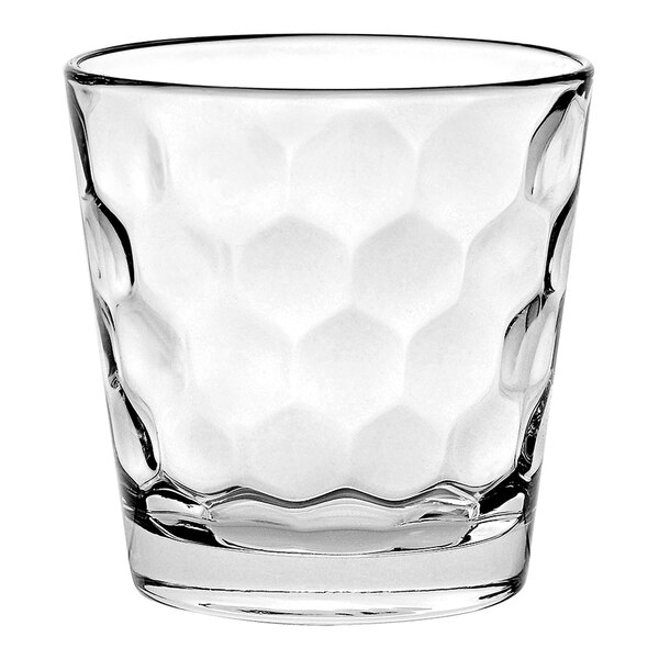 A clear Vidivi Honey rocks glass with hexagons.