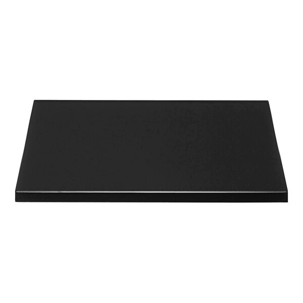 A black square table top with a microtexture surface on a white background.