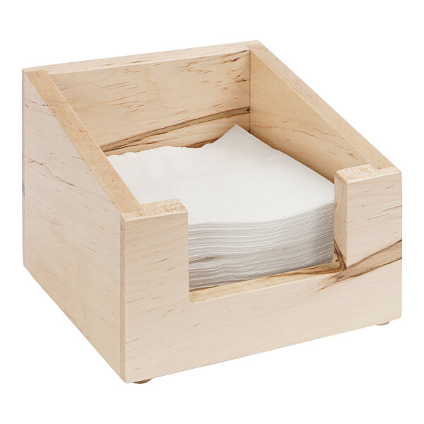 A Cal-Mil maple wood napkin holder with a stack of napkins inside.