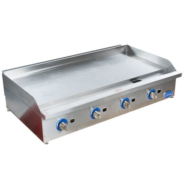A large stainless steel Globe countertop gas griddle.