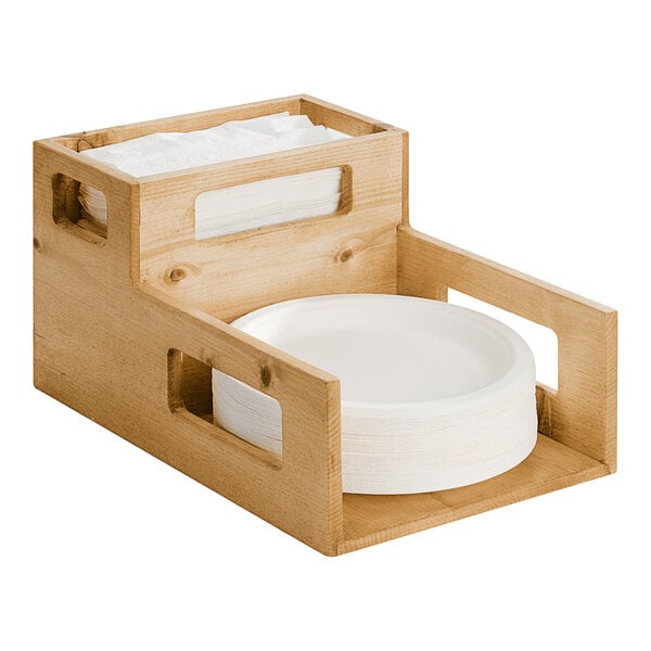 A Cal-Mil rustic pine wood holder with a stack of plates and napkins.