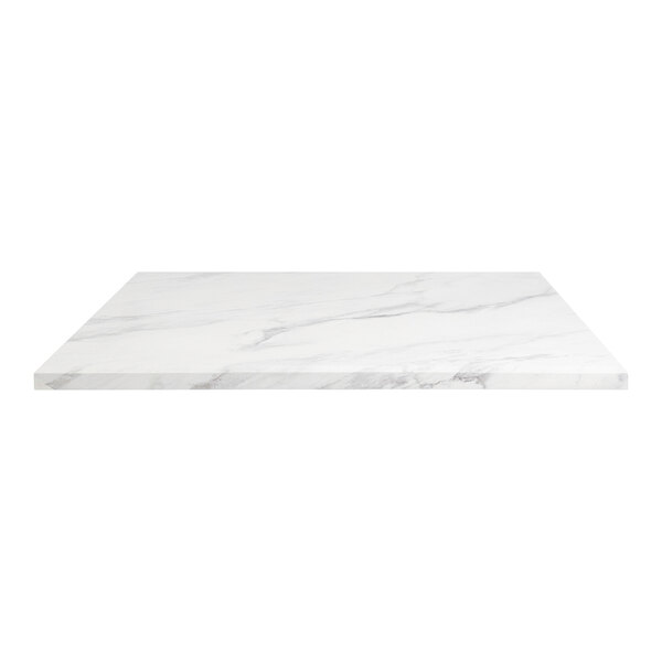 A white marble table top with grey veining.