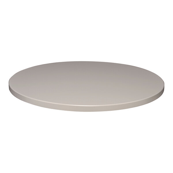 A Perfect Tables 24" round smooth stone gray table top on a table.