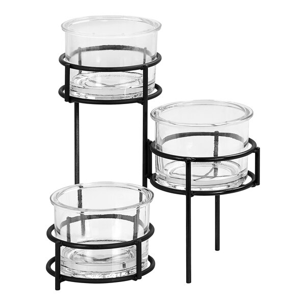 A black metal stand holding three glass containers.