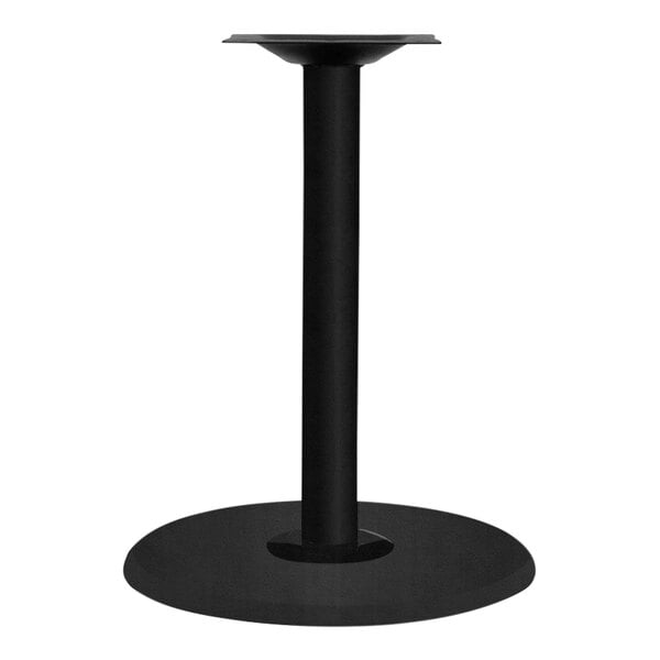 A black metal round pedestal base with a round column for a table with an umbrella hole.