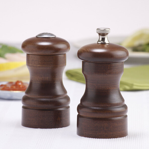 Two Chef Specialties salt and pepper shakers with walnut handles.